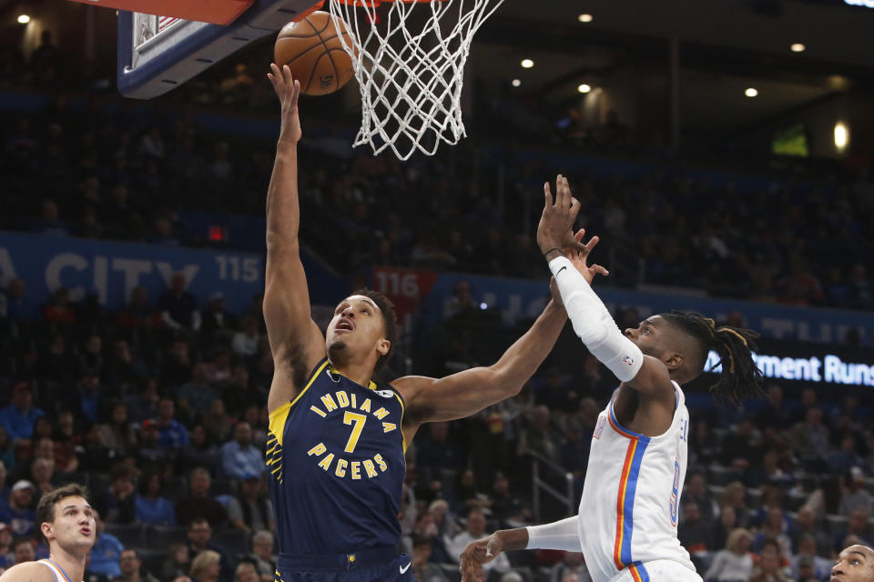 Indiana Pacers guard Malcolm Brogdon (7) shoots in front of Oklahoma City Thunder center Nerlens Noel, right, during the first half of an NBA basketball game Wednesday, Dec. 4, 2019, in Oklahoma City. (AP Photo/Sue Ogrocki)