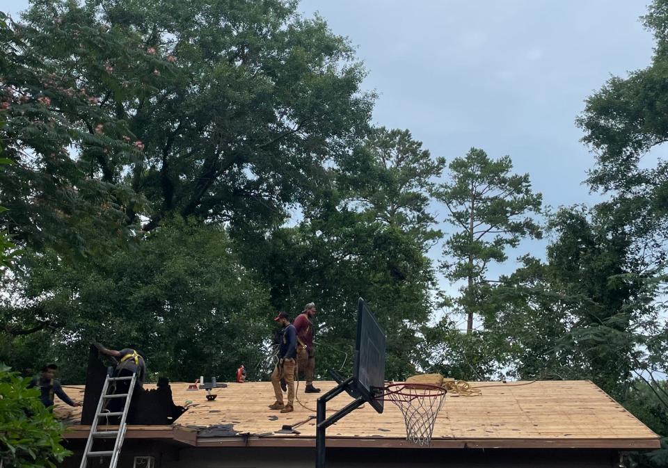 Tadlock Roofing pictured installing a new roof on June 12, 2023, as a part of their partnership with Owen Corning and Purple Heart Homes.