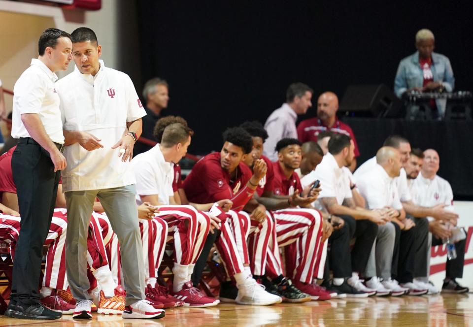 Indiana Hoosiers head coach Archie Miller (left) and assistant coach Tom Ostrom (right) talk during Hoosier Hysteria in 2019. Ostrom will join Darian DeVries as an assistant coach at Drake in the 2022-23 season.
