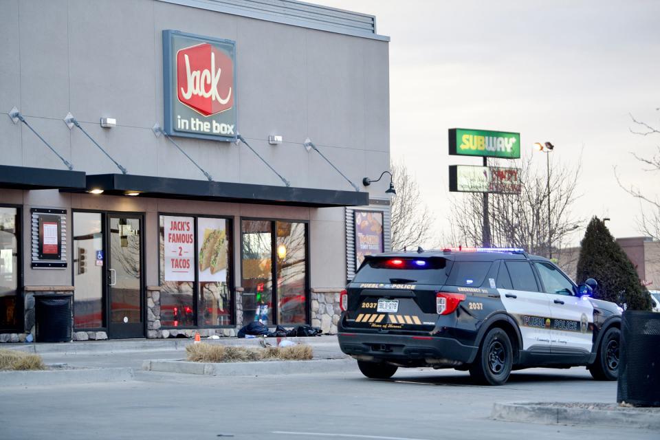 Pueblo police cordon off a scene at the US Highway 50 Jack in the Box location where an employee shot a man who was allegedly assaulting his girlfriend on Friday, Feb. 11, 2022.