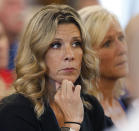 Widow Cindy Chesna listens during day one of the Emanuel Lopes trial for the 2018 murder of her husband Weymouth Police Sgt. Michael Chesna, in Norfolk Superior Court in Dedham, Mass., Thursday June 8, 2023. (Greg Derr/The Patriot Ledger via AP, Pool)