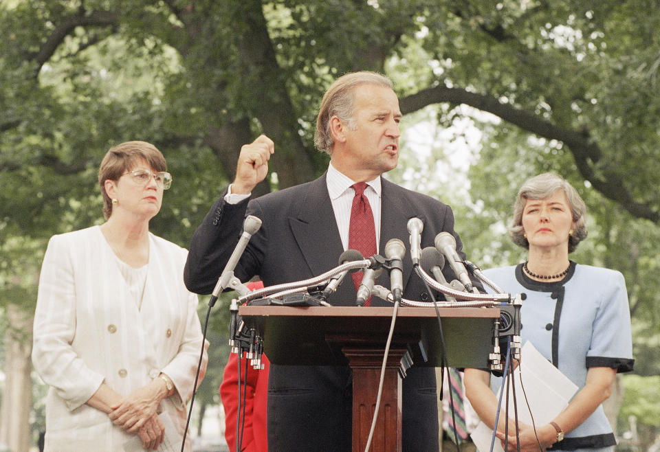 Sen. Joseph Biden (D-Del.), flanked by Attorney General Janet Reno, left, and Rep. Patricia Schroeder (D-Colo.), meets reporters on Capitol Hill, on July 19, 1994, to discuss the Violence Against Women Act. (Photo: ASSOCIATED PRESS)