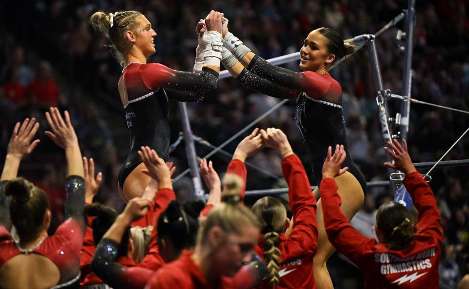 Isabella Neff, right, of SUU celebrates after her uneven bars routine with teammates as BYU, Utah, SUU and Utah State meet in the Rio Tinto Best of Utah Gymnastics competition at the Maverick Center in West Valley City on Monday, Jan. 15, 2024. | Scott G Winterton, Deseret News