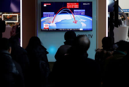 People watch a television broadcast of a news report on North Korea firing what appeared to be an intercontinental ballistic missile (ICBM) that landed close to Japan, in Seoul, South Korea, November 29, 2017. REUTERS/Kim Hong-Ji