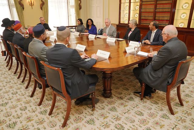 <p>JONATHAN BRADY/POOL/AFP via Getty Images</p> King Charles hosts the meeting of community faith leaders at Buckingham Palace on March 26, 2024