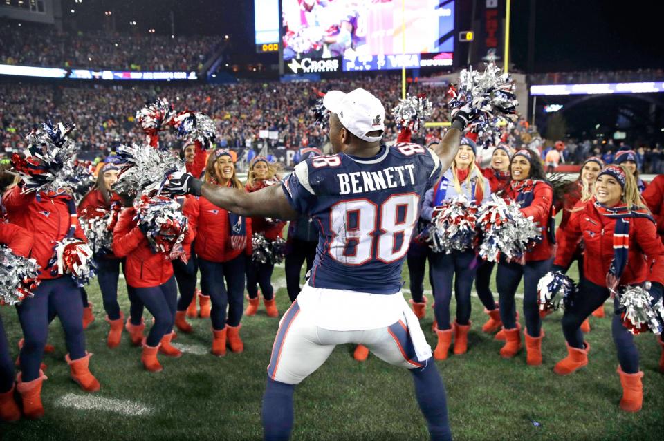 <p>New England Patriots tight end Martellus Bennett celebrates with cheerleaders after the AFC championship NFL football game against the Pittsburgh Steelers, Sunday, Jan. 22, 2017, in Foxborough, Mass. The Patriots defeated the the Steelers 36-17 to advance to the Super Bowl. (AP Photo/Charles Krupa) </p>