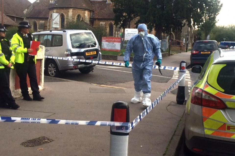 Police and forensic investigator at the scene of the raid at a property in Thornton Heath
