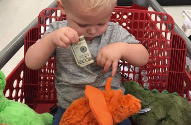 A grieving grandfather handed Owen a $20 note in Target so he could buy all three stuffed dinosaur toys he wanted. Picture: Alyssa Hacker/Facebook