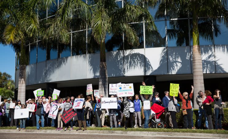 Demonstrators gather in front of Republican Sen. Marco Rubio’s office on West Kennedy Boulevard in Tampa on Tuesday to protest the recent actions of Donald Trump. Protesters say they plan to gather at Rubio’s office every Tuesday for the first 100 days of Trump’s presidency. (Loren Elliott/Tampa Bay Times via ZUMA Wire)