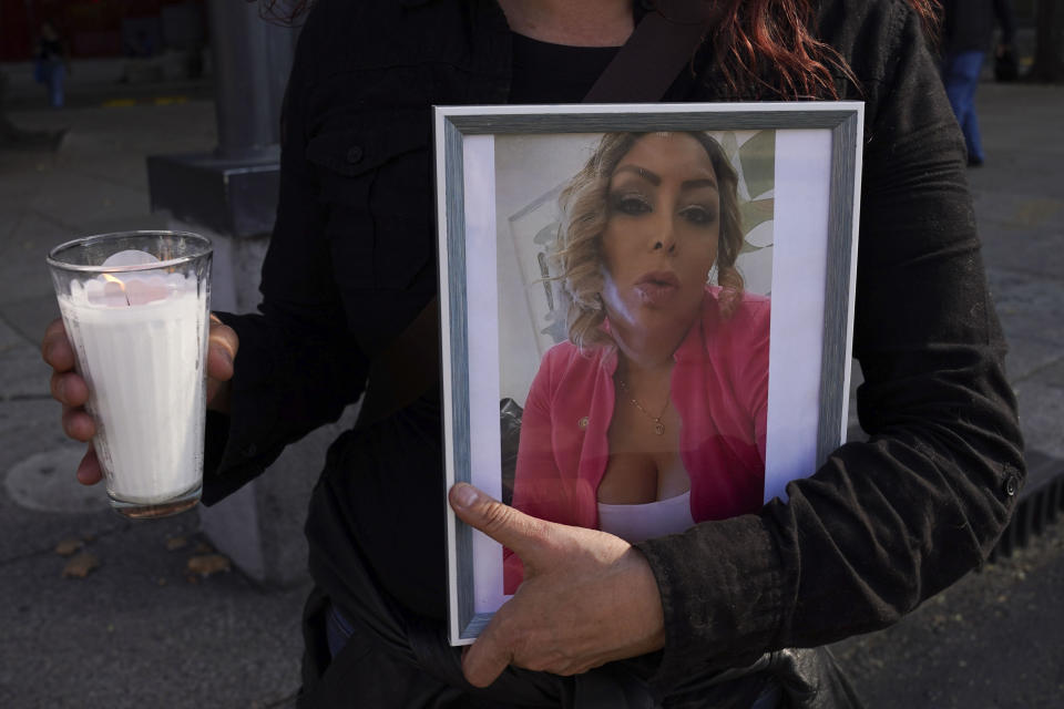 A member of the LGBTQ+ community holds a portrait of transgender activist Samantha Gomes Fonseca during a rally to protest her murder in Mexico City, Monday, Jan. 15, 2024. Gomes was shot in Mexico City Sunday. (AP Photo/Marco Ugarte)