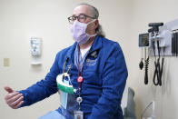 Dr. Alan Roth talks to reporters at Jamaica Hospital Medical Center in New York, Tuesday, Dec. 29, 2020. Dozens of clinics have cropped up around the U.S. to address a puzzling and troubling aspect of COVID-19 — the after-effects that can stubbornly afflict some people weeks or months after the infection itself has subsided. “We know this is real,” said Roth, who oversees the Jamaica Hospital clinic. He has been grappling with body pain, fatigue and “brain fog” characterized by occasional forgetfulness since his own relatively mild bout with COVID-19 in March. (AP Photo/Seth Wenig)