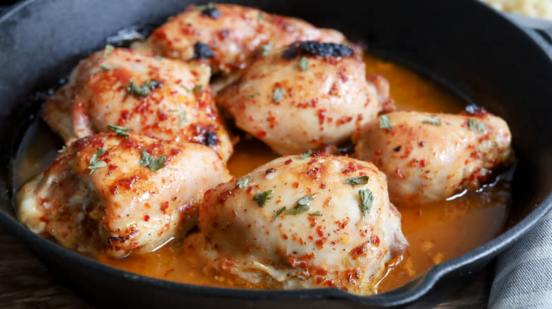 cooked chicken thighs in pan