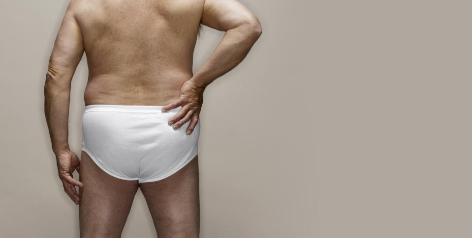 Rear view of man wearing baggy white briefs