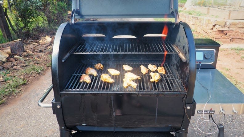 Unlike other pellet grills, the SmokeFire doesn't have a large heat deflector plate, allowing you to sear as well as smoke.