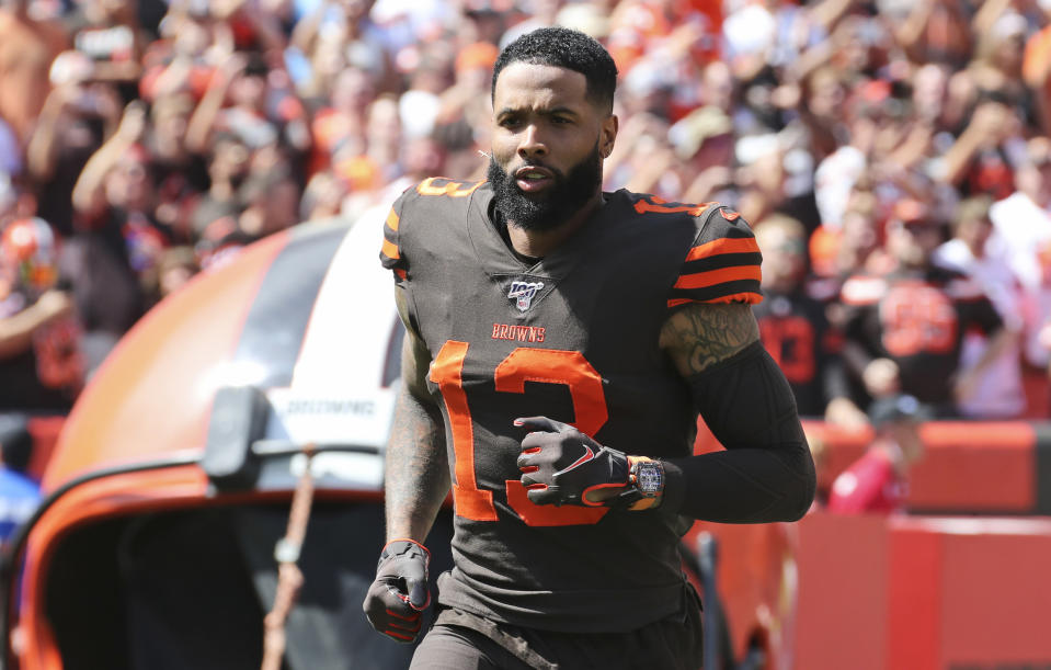 FILE - In this Sunday, Sept. 8, 2019, file photo, Cleveland Browns wide receiver Odell Beckham Jr. is introduced as he runs out on the field before an NFL football game against the Tennessee Titans, in Cleveland. Odell Beckham Jr. says former Browns defensive coordinator Gregg Williams instructed his players to "take me out" of a preseason game in 2017. The Pro Bowl wide receiver sustained an ankle injury when Cleveland's Briean Boddy-Calhoun cut his legs out while he was with the New York Giants. Beckham said current Cleveland players told him that Williams instructed them to "take me out of the game, and it's preseason." (AP Photo/Ron Schwane, File)