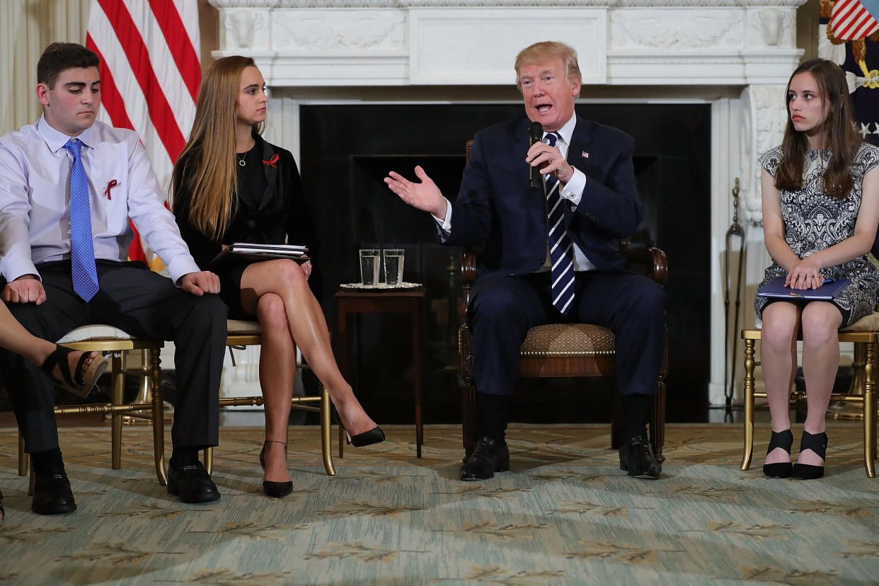 President Donald Trump holds a listening session with students, parents and teachers in the State Dining Room at the White House February 21, 2018 in Washington, DC. (Photo by Chip Somodevilla/Getty Images)