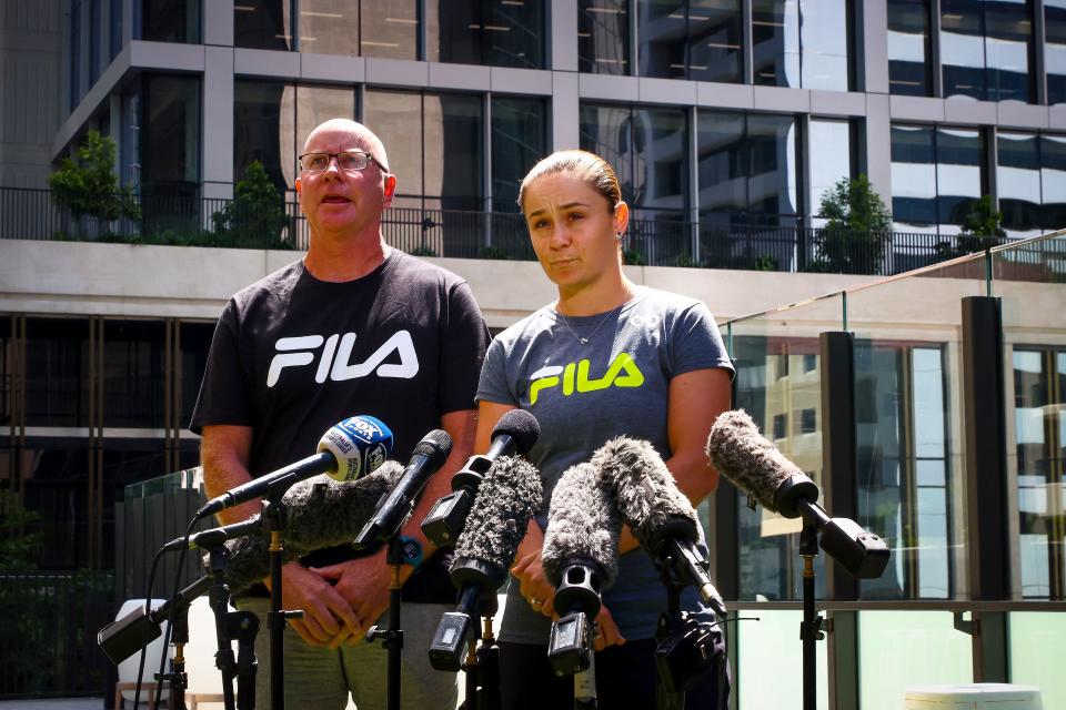 Seen here, Ash Barty and her coach Craig Tyzzer speaking about the tennis star's shock retirement on Thursday. 