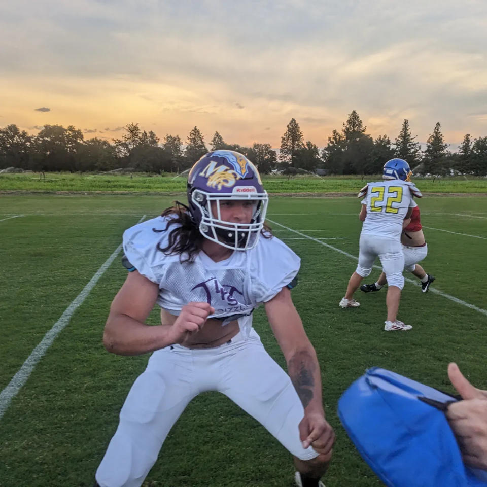 Lassen High School graduate Ben Wheeler (center) throws a block during practice at Shasta College for the 46th Lions All-Star game on Wednesday, June 14, 2023.