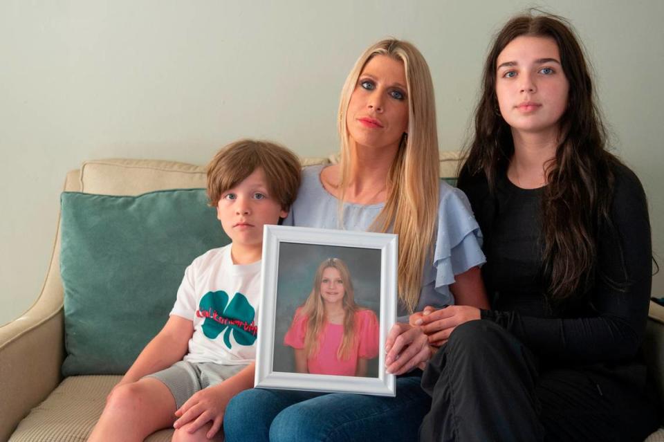 Heather Wyatt, center, and her children Taylor, 16, right, and Ryker, 7, at the Wyatt’s home in Ocean Springs on Tuesday, March 12, 2024. Heather and her children were making TikToks and printing t-shirts to raise awareness for suicide prevention following the death of Heather’s daughter Aubreigh by suicide in 2023.