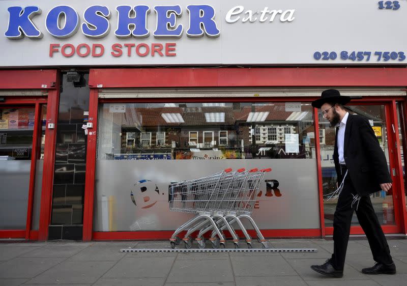 FILE PHOTO: An orthodox Jewish man walks past a shop in Golders Green north London