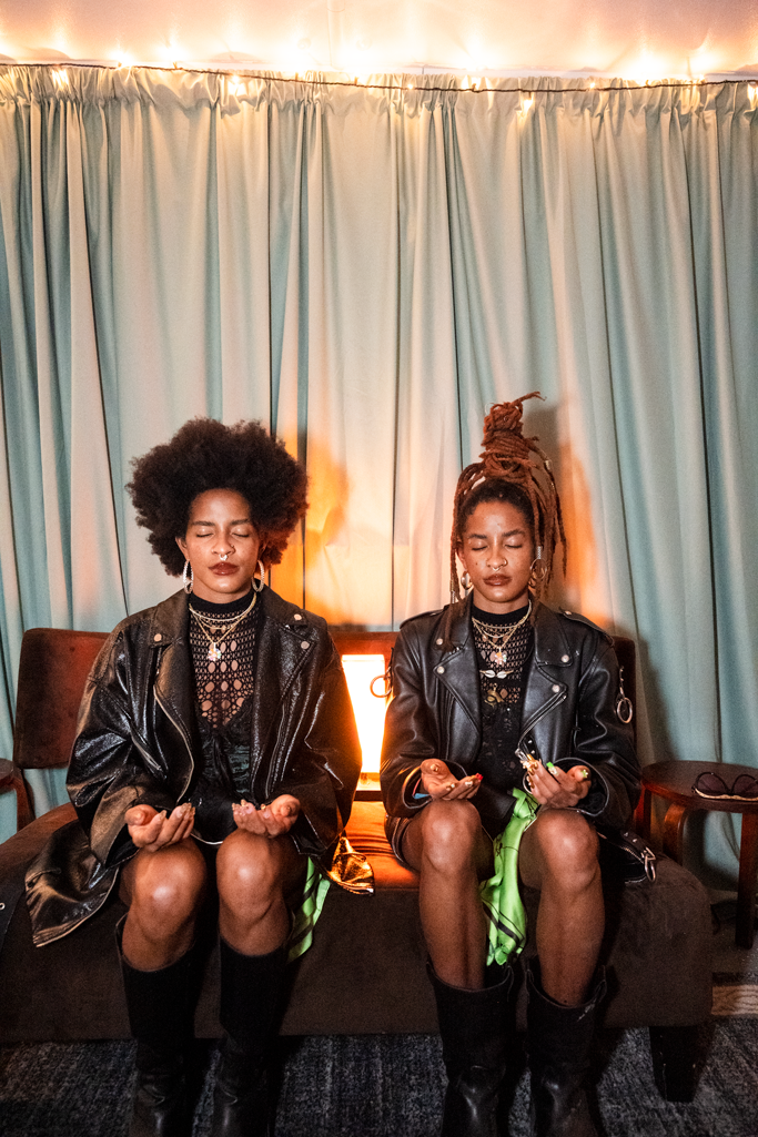 Sisters Coco & Breezy meditating as part of their pre-show ritual.