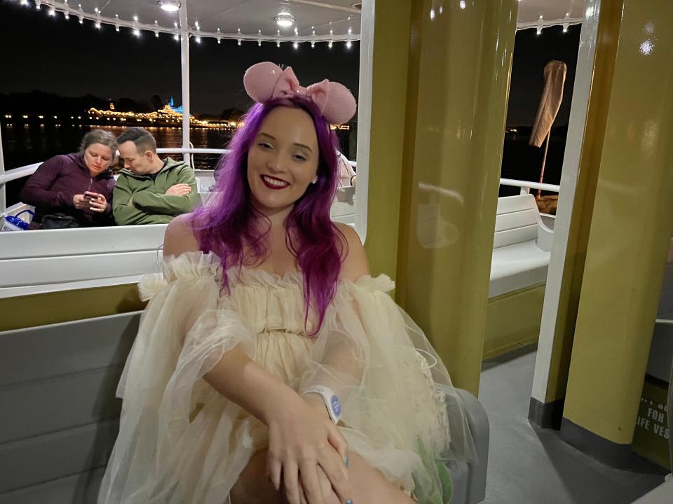 jenna posing for a photo on the resort boat from magic kingdom to grand floridian