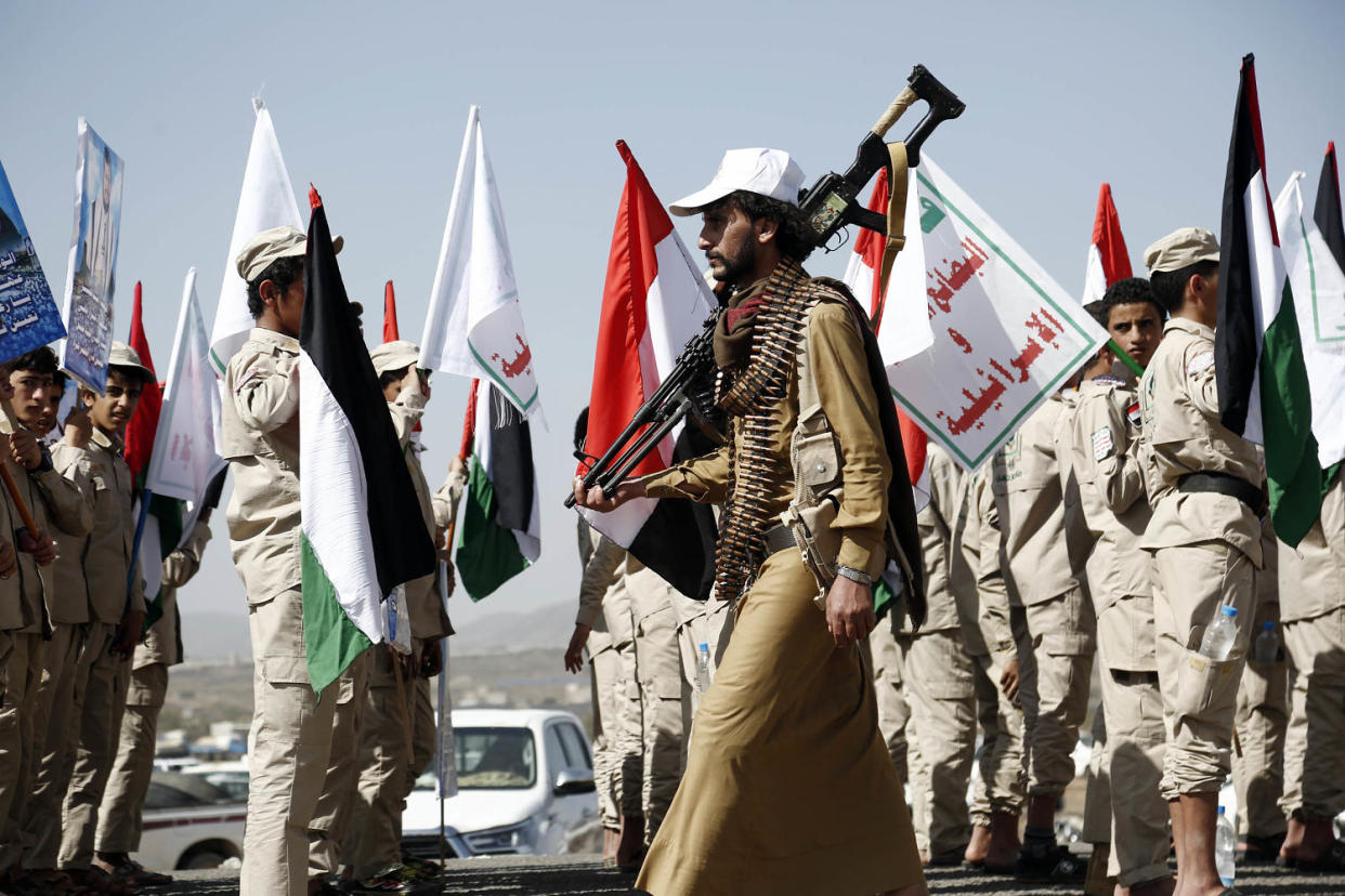 Houthis at a rally in support of Palestinians in the Gaza Strip, and the recent Houthi strikes on shipping in the Red Sea and Gulf of Aden on Feb. 4, 2024 on the outskirts of Sana'a, Yemen.  (Mohammed Hamoud / Getty Images)