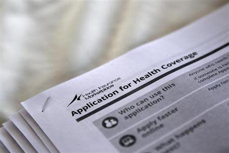 The federal government forms for applying for health coverage are seen at a rally held by supporters of the Affordable Care Act, widely referred to as "Obamacare", outside the Jackson-Hinds Comprehensive Health Center in Jackson, Mississippi October 4, 2013. REUTERS/Jonathan Bachman