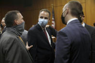 Deputy District Attorney John Lewin, left, congratulates attorney Habib A. Balian, center, after New York real estate heir Robert Durst was found guilty Friday, Sept. 17, 2021 in Inglewood, Calif. A Los Angeles jury convicted Robert Durst on Friday of murdering his best friend 20 years ago, a case that took on new life after the New York real estate heir participated in a documentary that connected him to the slaying that was linked to his wife’s 1982 disappearance. (Genaro Molina/Los Angeles Times via AP, Pool)