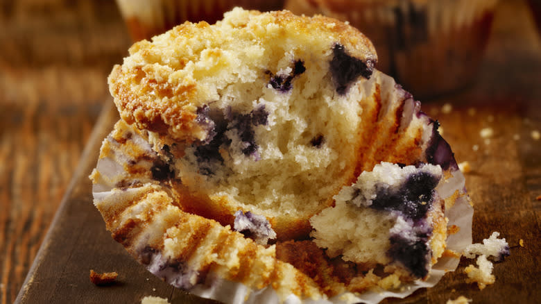 Half a blueberry muffin in case