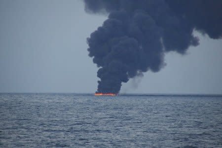 FILE PHOTO: Flames and smoke from the Iranian oil tanker Sanchi is seen in the East China Sea, on January 15, 2018 in this photo provided by Japan's 10th Regional Coast Guard. 10th Regional Coast Guard Headquarters/Handout via REUTERS