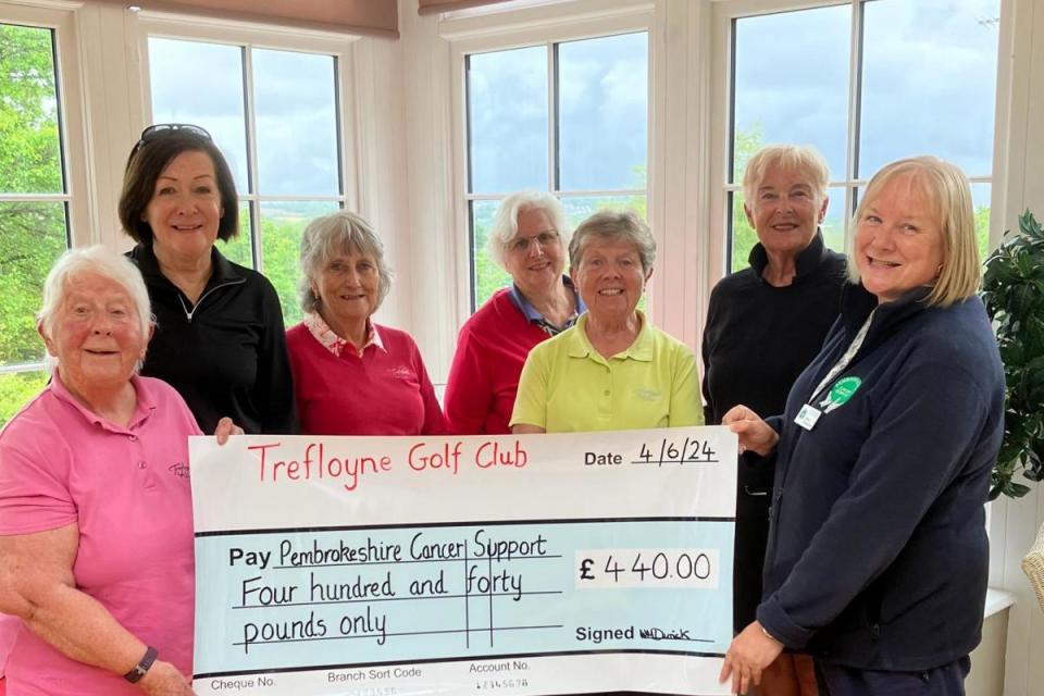 Competition organiser Wendy Derrick (left) and Trefloyne members present the £440 chequer to Pembrokeshire Cancer Support. <i>(Image: Trefloyne Golf Club)</i>