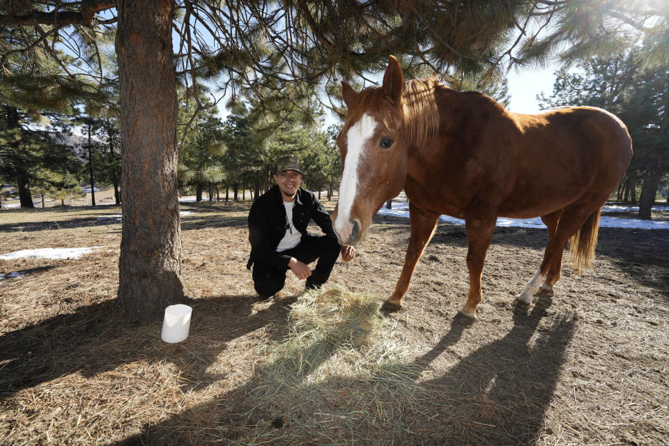 Jason Lopez, a proponent of a Colorado general election ballot measure to decriminalize psychedelic mushrooms, is shown on his family's property Sunday, Oct. 30, 2022, near Morrison, Colo. If the measure passes next Tuesday, Colorado would become the second state in the union—behind only Oregon—to decriminalize the psychedelic mushrooms. (AP Photo/David Zalubowski)