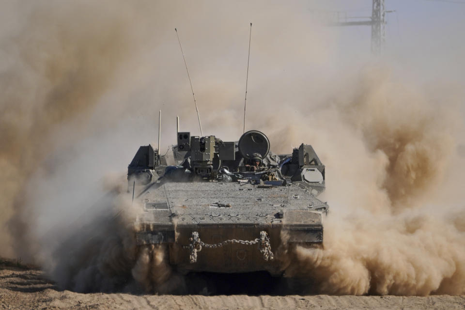 An Israeli armoured personnel carrier (APC) moves near the Gaza Strip border in southern Israel, Thursday, Feb. 29, 2024. (AP Photo/Tsafrir Abayov)