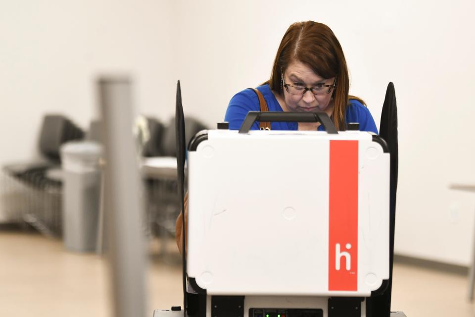 An Anderson County voter fills out a ballot on one of the new voting machines at the Oak Ridge Senior Center on Tuesday, March 5, 2024 in Oak Ridge, Tenn.