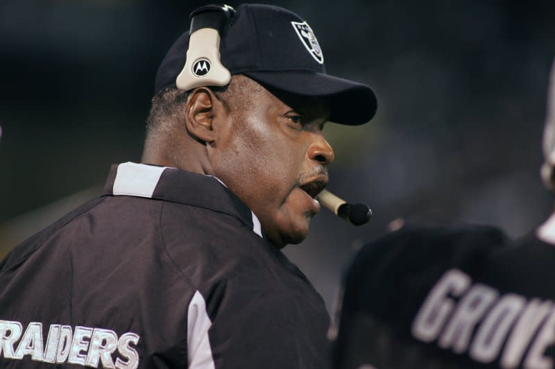 Oakland Raiders coach Art Shell talks to the coaches upstairs during play against the San Diego Chargers at McAfee Coliseum in Oakland, Calif., on September 11, 2006. On October 4, 1989, Shell was hired by the Oakland Raiders as the first black head coach in the modern National Football League. File Photo by Terry Schmitt/UPI