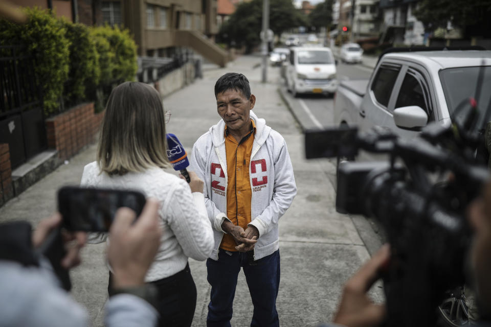 Narciso Mucutuy, the grandfather of the 4 rescued Indigenous children, speaks to the media from the entrance of the military hospital where the children who survived an Amazon plane crash that killed three adults and then braved the jungle for 40 days before being found alive, are receiving medical attention, in Bogota, Colombia, Sunday, June 11, 2023. (AP Photo/Ivan Valencia)