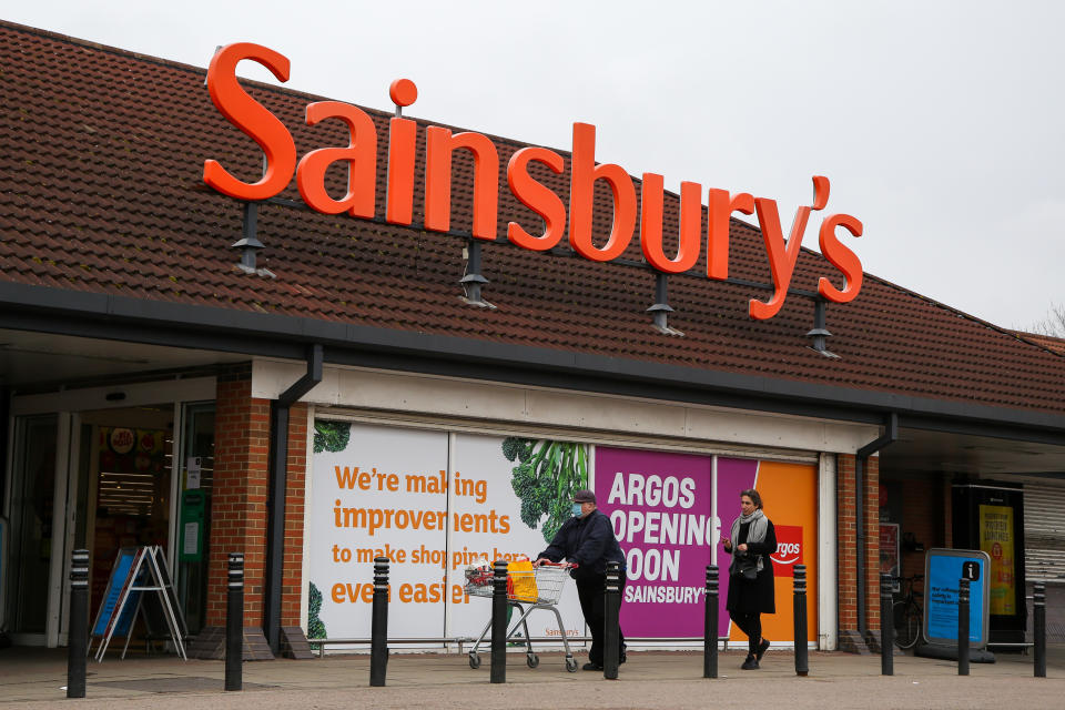 LONDON, UNITED KINGDOM - 2021/03/18: Shoppers walk past Sainsbury's supermarket after making purchases in London. (Photo by Dinendra Haria/SOPA Images/LightRocket via Getty Images)