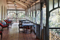 Verandah in the Forest, Matheran. Photo: Tom Parker - Trek up to the Garbert Plateau, enjoy long walks with your loved one amidst the old trees, picnic along Charlotte Lake, and watch the sunset from one of the 33 viewing spots overlooking misty valleys. For a different kind of romantic experience, stay at the Verandah in the Forest by Neemrana Hotels, and step back into the 19th century. 