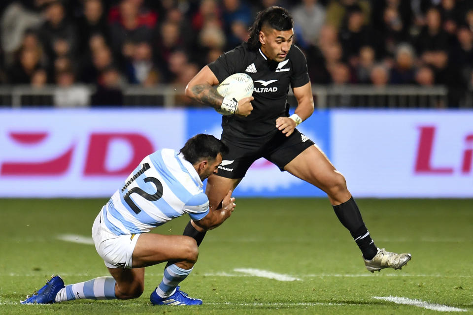 Rieko Ioane of New Zealand, right, is tackled by Matias Orlando of Argentina during their Rugby Championship test match in Christchurch, New Zealand, Saturday, Aug. 27, 2022. (John Davidson/Photosport via AP)