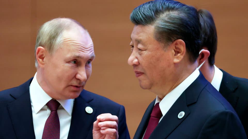 Putin speaks to Xi at the SCO summit two years ago in Samarkand, Uzbekistan. - Sergei Bobylev/Pool/Sputnik/AP