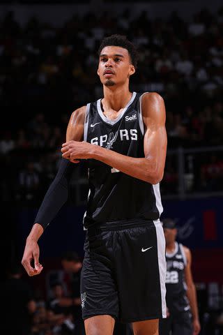 <p>Bart Young/NBAE</p> Victor Wembanyama #1 of the San Antonio Spurs prepares to shoot a free throw during the 2023 NBA Las Vegas Summer League on July 9, 2023