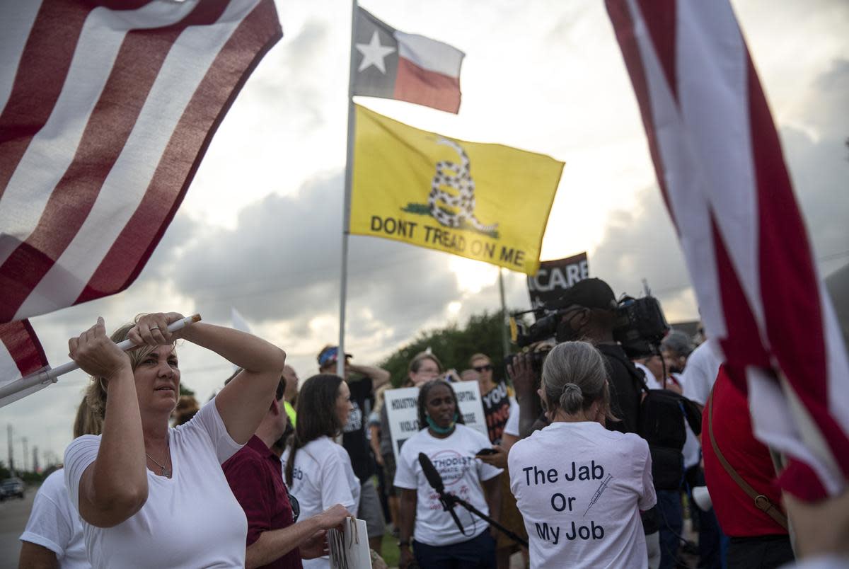 Medical personnel ralled against Houston Methodist Hospital's COVID-19 vaccine mandate outside the Baytown facility on June 7, 2021. Several employees who chose not to inoculate themselves worked their last shift Monday and will face job termination, a policy criticized by the protesters as unfair and unauthorized.