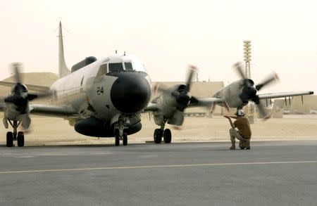 FILE PHOTO: A U.S. Navy EP-3E Aries aircraft is directed by ground crew after a flight from Bahrain September 25, 2016. U.S. Air Force/Staff Sgt. Rhiannon Willard/Handout/File photo via REUTERS