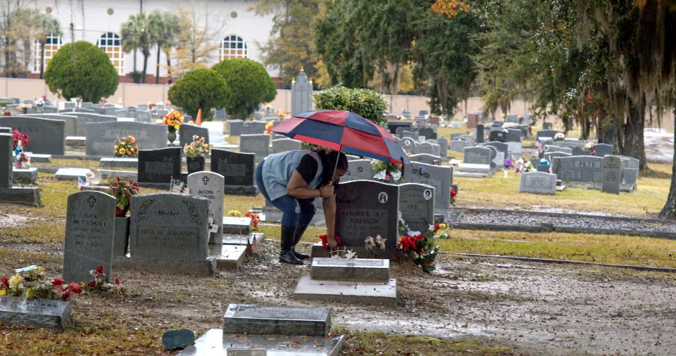 Kendrick Johnson's mother, Jacquelyn Johnson, visits her son's gravesite. (Jason Pollock)