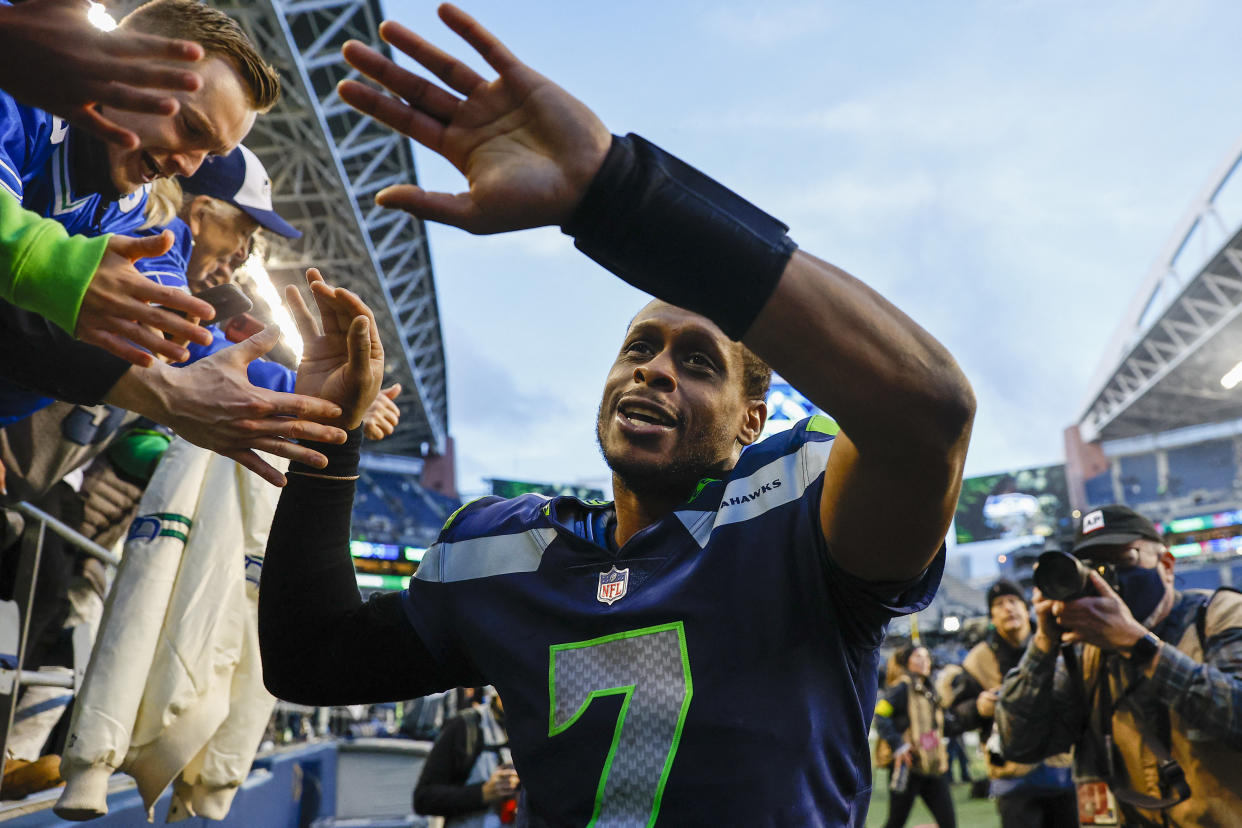 Jan 1, 2023; Seattle, Washington, USA; Seattle Seahawks quarterback Geno Smith (7) celebrates with fans following a 23-6 victory against the New York Jets at Lumen Field. Mandatory Credit: Joe Nicholson-USA TODAY Sports