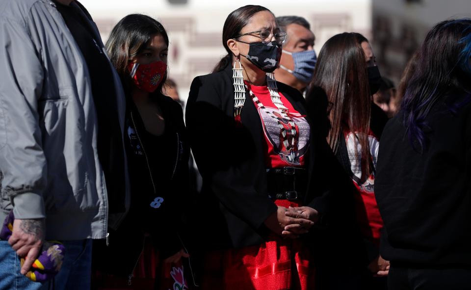 Oneida Nation holds a tobacco-burning and smudging ceremony May 5, 2021, on the Oneida Casino property after a shooter killed two people and injured a third on May 1, 2021, in Ashwaubenon, Wis. A walk to bring awareness to Missing and Murdered Indigenous Women, represented by the color red, was held after the ceremony. May 5 was also MMIW Awareness Day in Wisconsin.