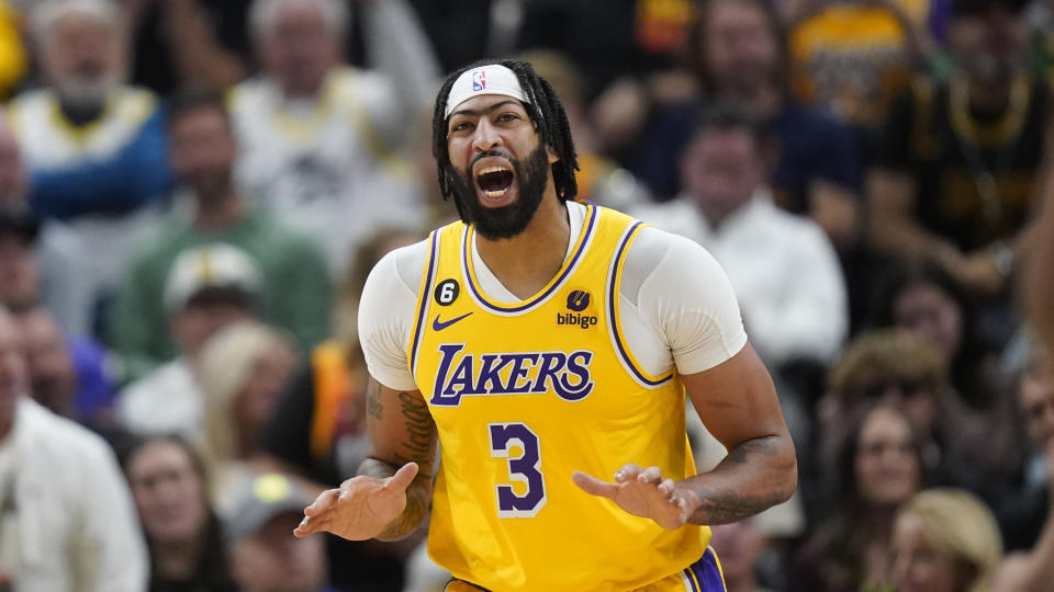 Los Angeles Lakers forward Anthony Davis (3) shouts as he runs up court during the second half of an NBA basketball game against the Utah Jazz Monday, Nov. 7, 2022, in Salt Lake City. (AP Photo/Rick Bowmer)