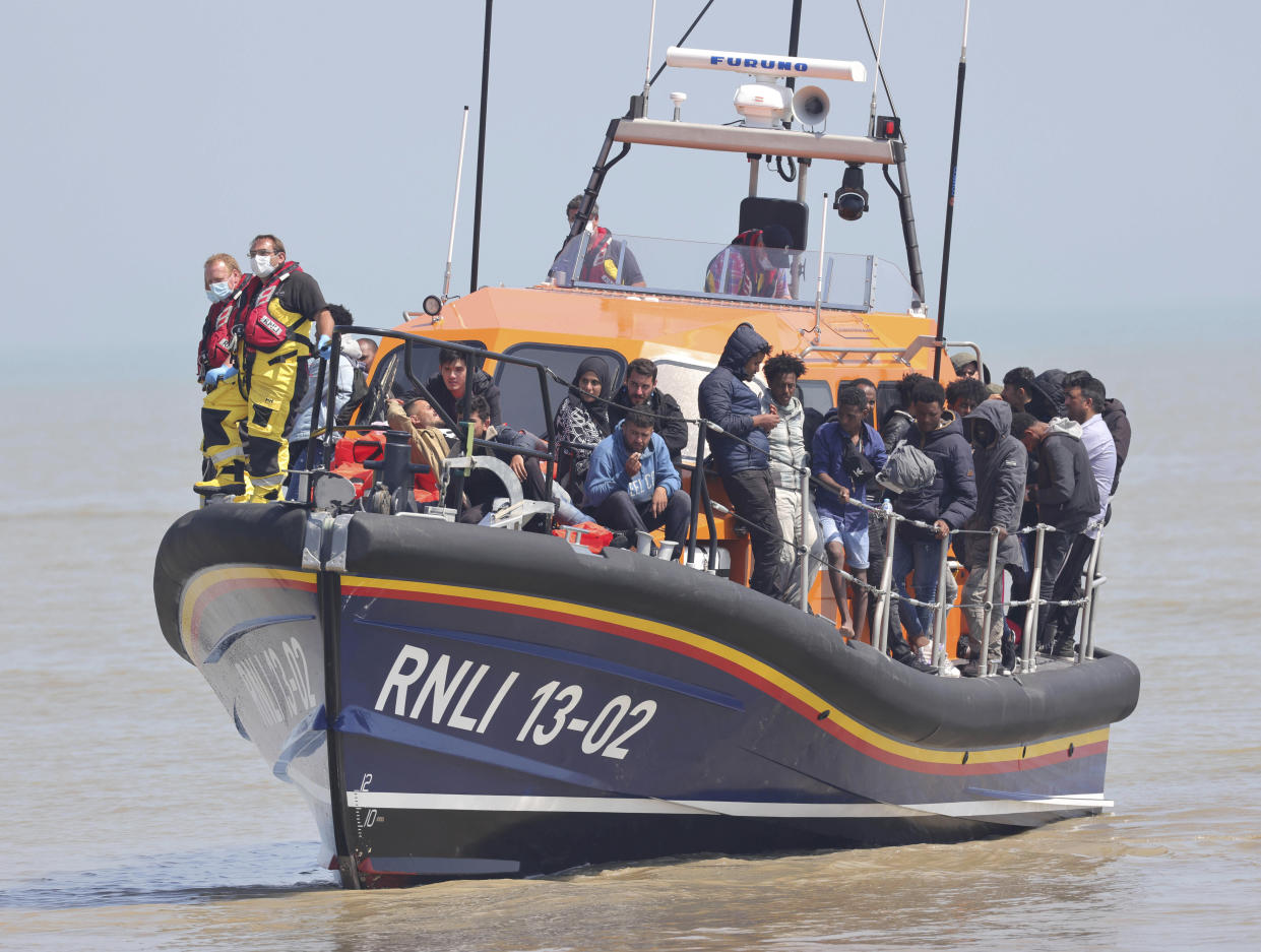 Photo by: KGC-330/STAR MAX/IPx 2021 7/20/21 Record numbers of migrants have been taking advantage of the calm seas in making the channel crossing from Calais to Kent. Here, migrants are brought ashore on July 20, 2021 by Dungeness lifeboat at Dungeness Kent. (Dover, England, UK)