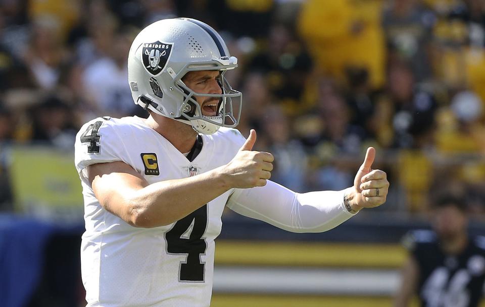 Las Vegas Raiders quarterback Derek Carr (4) gestures on the field against the Pittsburgh Steelers during the fourth quarter at Heinz Field.